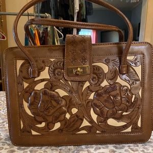 Vintage Mont-Abur Aztec purse brown toiled leather Suede in the inside. 1970’s